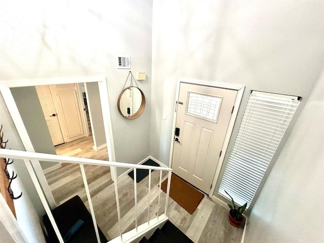 entrance foyer with light hardwood / wood-style floors