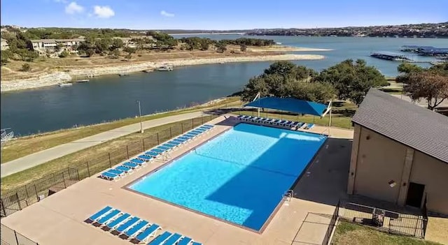 view of pool featuring a water view