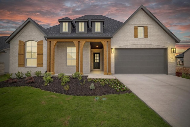 208 San Xavier St, Georgetown, TX 78633 - french provincial home with brick siding, driveway, a yard, an attached garage, and a shingled roof