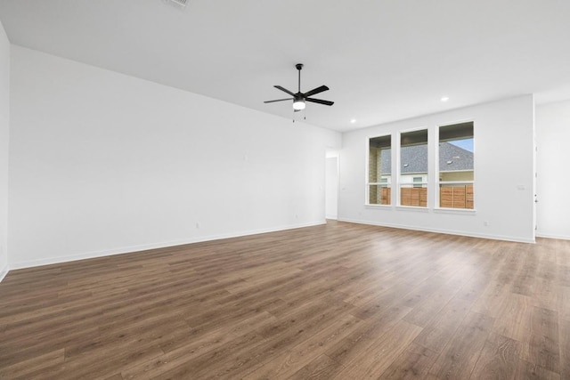 208 San Xavier St, Georgetown, TX 78633 - spare room with wood finished floors, a ceiling fan, and recessed lighting