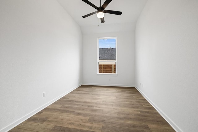 208 San Xavier St, Georgetown, TX 78633 - empty room featuring ceiling fan, vaulted ceiling, and dark wood-style floors