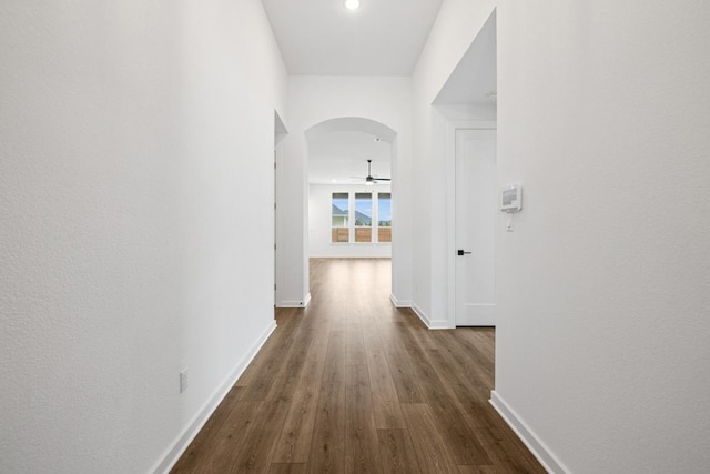 208 San Xavier St, Georgetown, TX 78633 - hallway with arched walkways, dark wood-type flooring, and recessed lighting