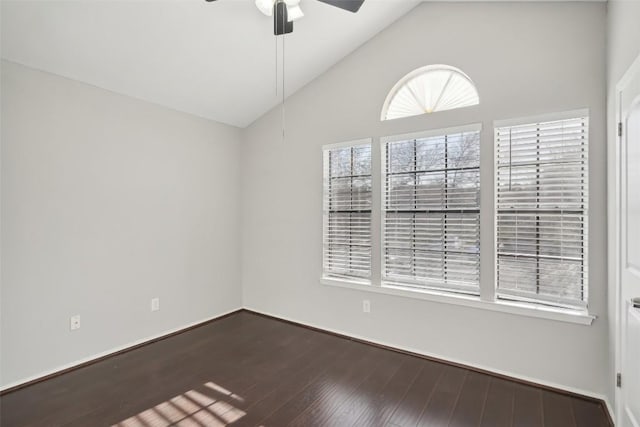 spare room featuring ceiling fan, lofted ceiling, and hardwood / wood-style flooring