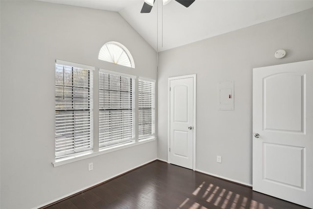 unfurnished room featuring ceiling fan, high vaulted ceiling, and dark hardwood / wood-style floors