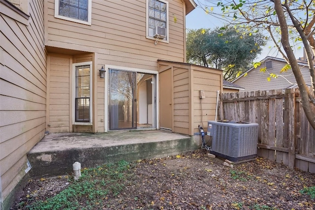 property entrance featuring cooling unit, central air condition unit, and a patio