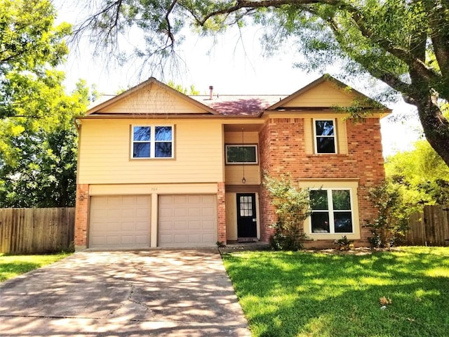 view of front of house featuring a front lawn and a garage