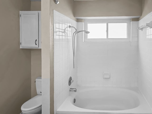 bathroom featuring toilet and bathtub / shower combination