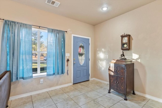 entrance foyer with light tile patterned floors