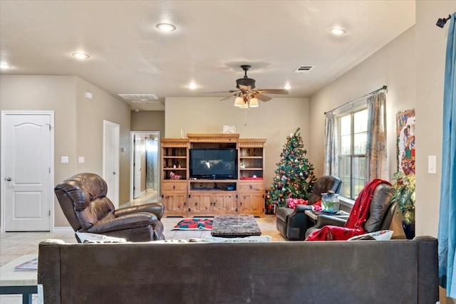 tiled living room with ceiling fan