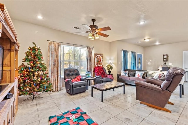 tiled living room with ceiling fan