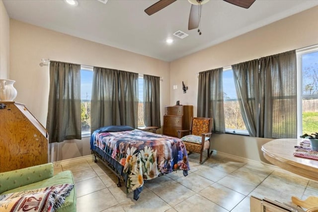 tiled bedroom with ceiling fan