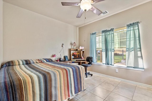 tiled bedroom with ceiling fan