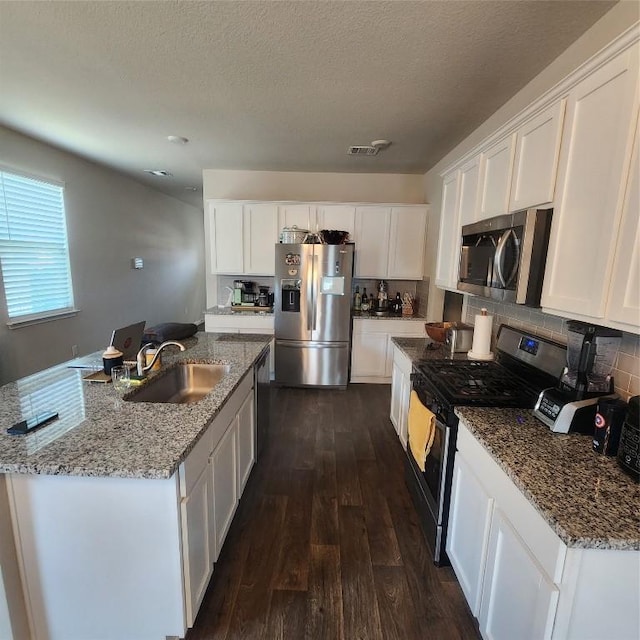 kitchen featuring white cabinetry and stainless steel appliances