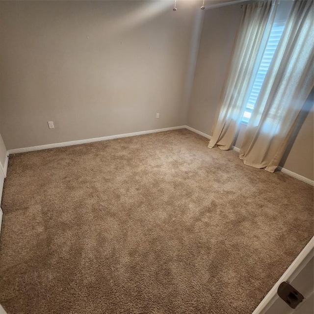 spare room featuring carpet flooring