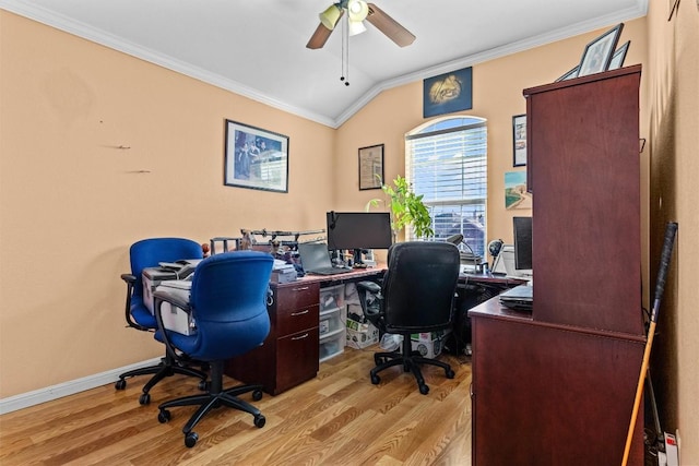 office space with light wood-type flooring, vaulted ceiling, ceiling fan, and crown molding