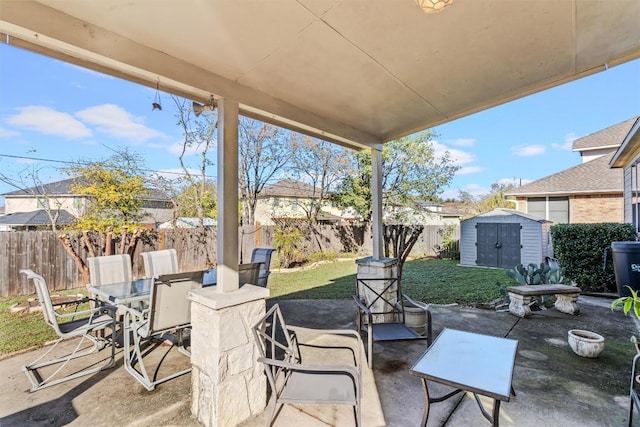 view of patio with a storage unit