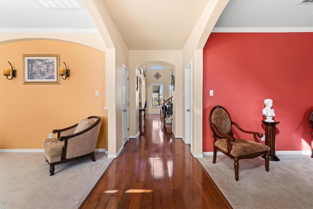 corridor with dark hardwood / wood-style floors and crown molding