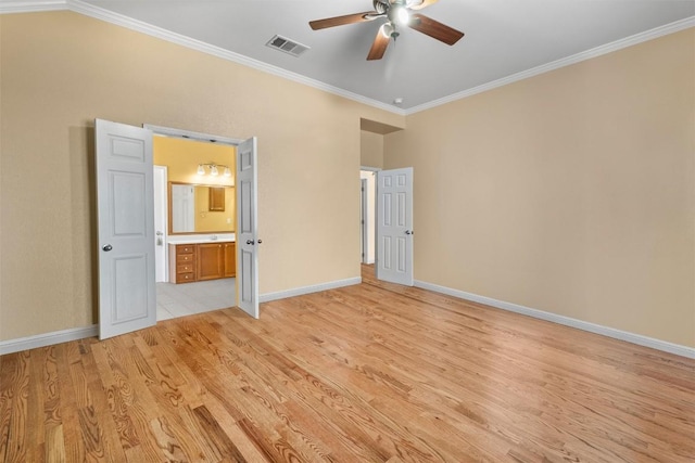 unfurnished bedroom with lofted ceiling, ensuite bathroom, ceiling fan, light wood-type flooring, and ornamental molding