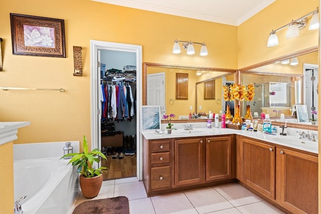 bathroom with a bathtub, tile patterned flooring, vanity, and ornamental molding