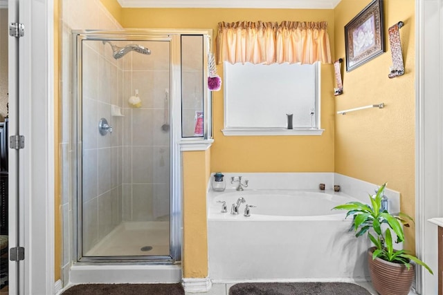 bathroom with shower with separate bathtub