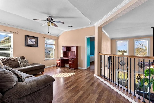 living room with ceiling fan, hardwood / wood-style floors, a textured ceiling, lofted ceiling, and ornamental molding