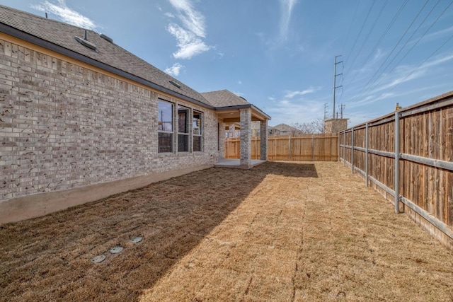 view of yard featuring a fenced backyard