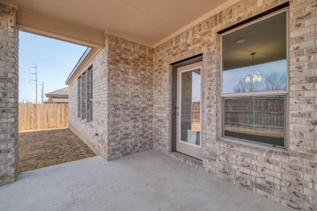 view of patio featuring fence