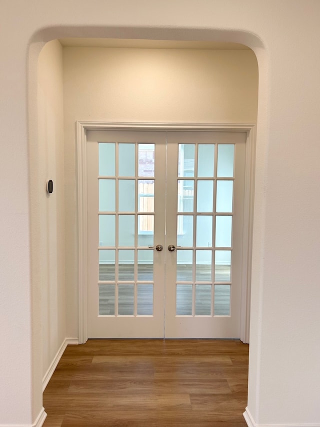 doorway featuring french doors and hardwood / wood-style floors