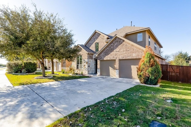 view of front facade featuring driveway, a front lawn, a garage, and fence