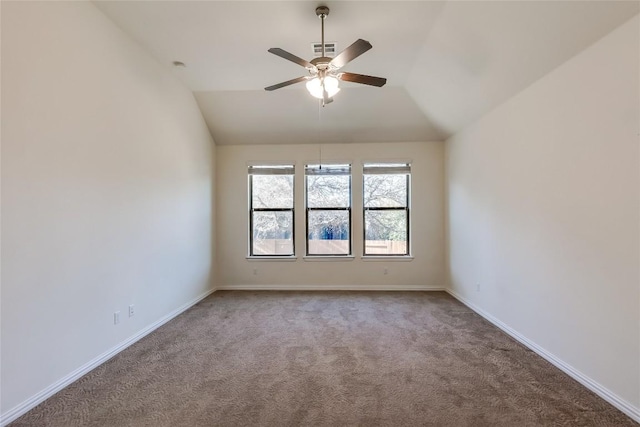 carpeted empty room with ceiling fan and lofted ceiling