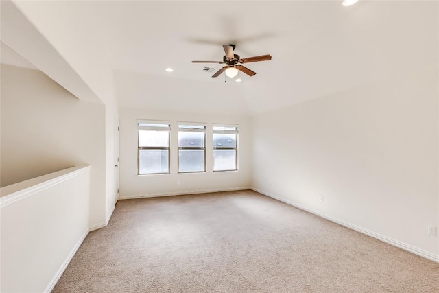 carpeted empty room featuring ceiling fan