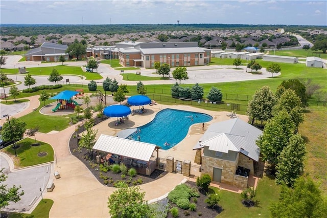 view of swimming pool featuring a playground