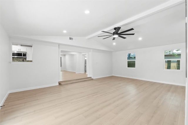 unfurnished living room featuring lofted ceiling with beams, light hardwood / wood-style floors, and ceiling fan