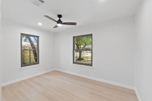 unfurnished room featuring ceiling fan and light wood-type flooring