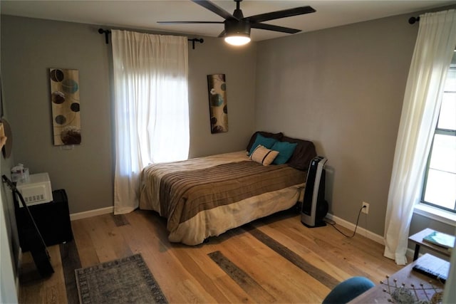 bedroom featuring ceiling fan and light hardwood / wood-style flooring