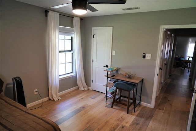 interior space with light hardwood / wood-style floors and ceiling fan