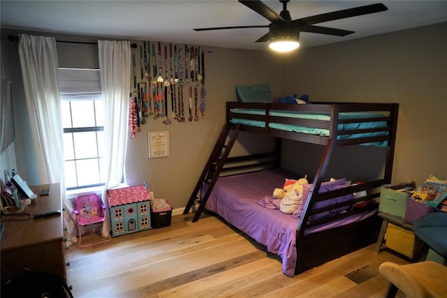 bedroom featuring ceiling fan and light wood-type flooring