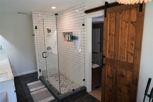 bathroom featuring tile patterned floors, vanity, and walk in shower