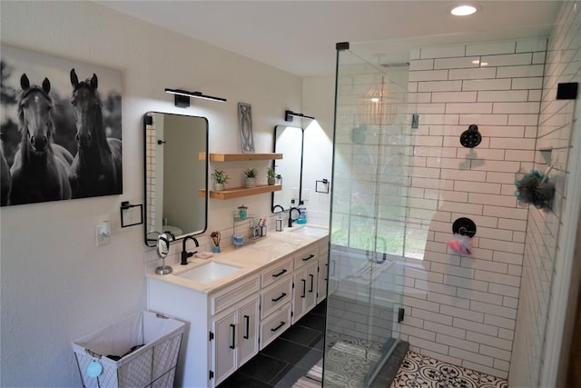 bathroom with vanity, tile patterned floors, and an enclosed shower