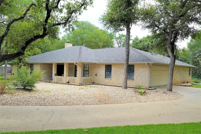 ranch-style house featuring a garage