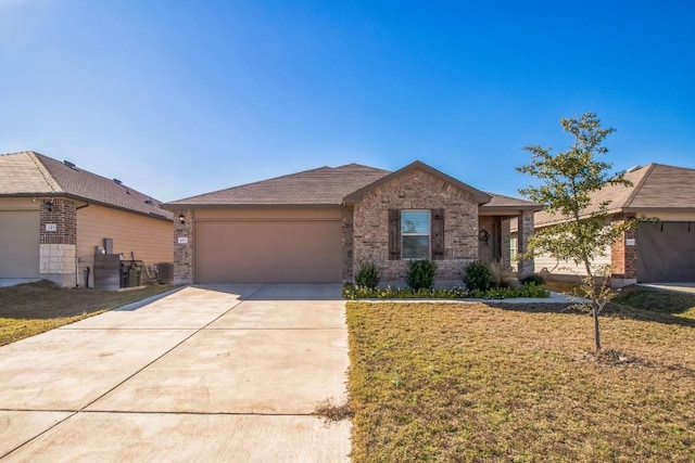 ranch-style home with a garage and a front lawn