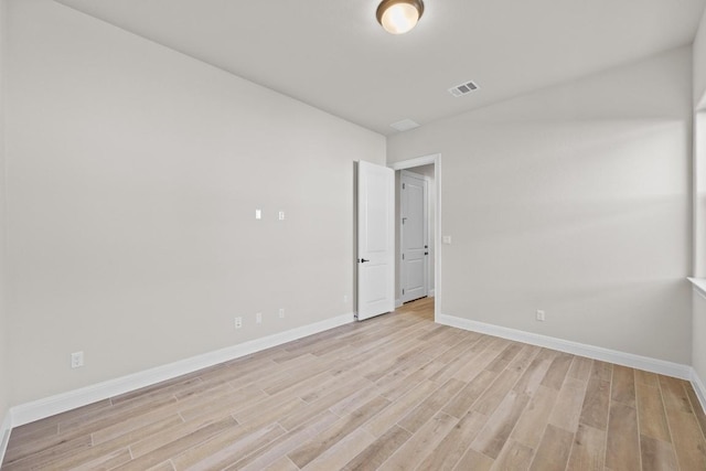 unfurnished room with light wood-type flooring