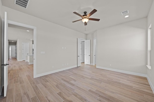 unfurnished room featuring ceiling fan and light hardwood / wood-style flooring