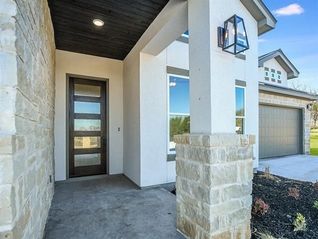 property entrance featuring a garage