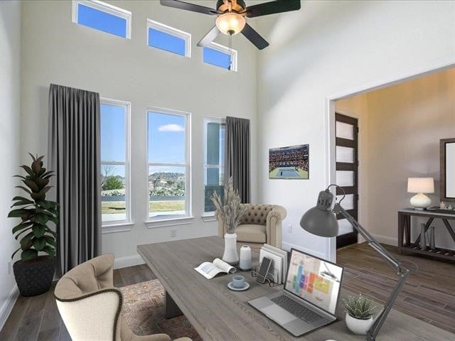 office area with ceiling fan and dark hardwood / wood-style floors