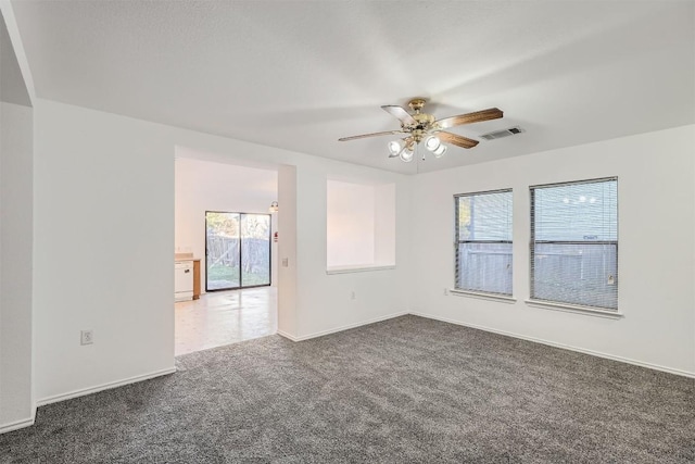 carpeted empty room with ceiling fan