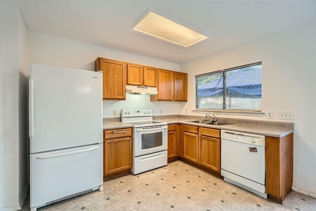 kitchen featuring white appliances and sink