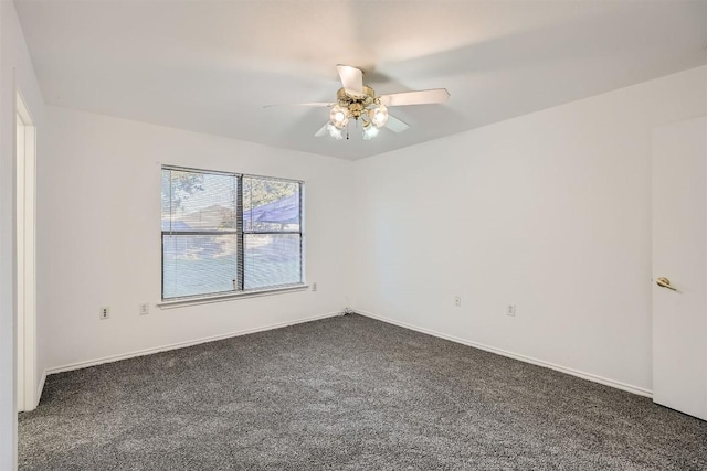 unfurnished room featuring dark colored carpet and ceiling fan