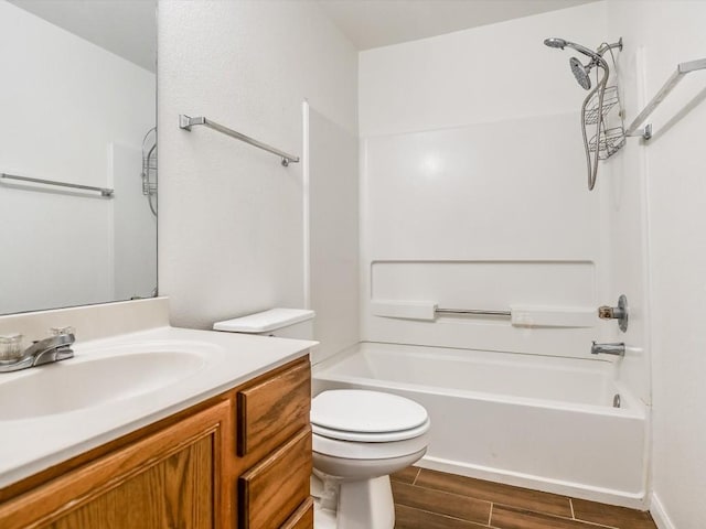 full bathroom featuring vanity, toilet, and washtub / shower combination