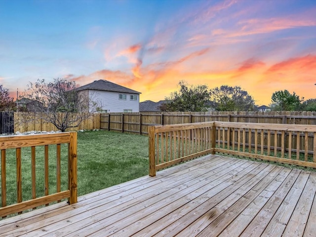 deck at dusk with a lawn